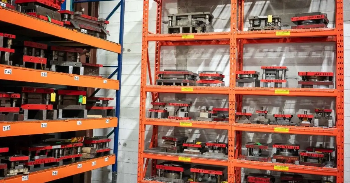 Metal stamping dies organized in warehouse storage